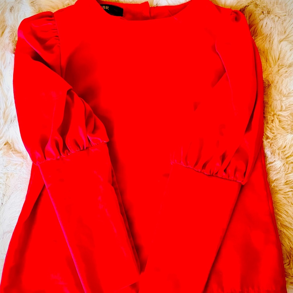 Red blouse with gold button accents. Size small. Worn once.
